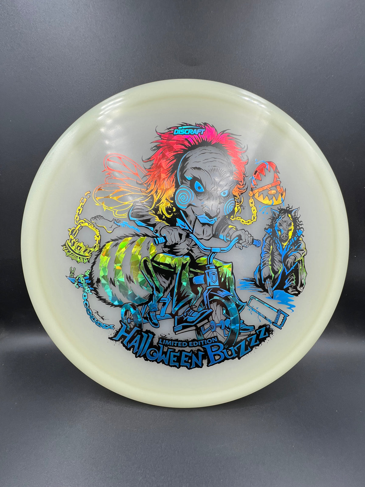 Discraft 2026 Mega Glo Halloween Buzzz Rainbow Shatter Blue - 175g-176g