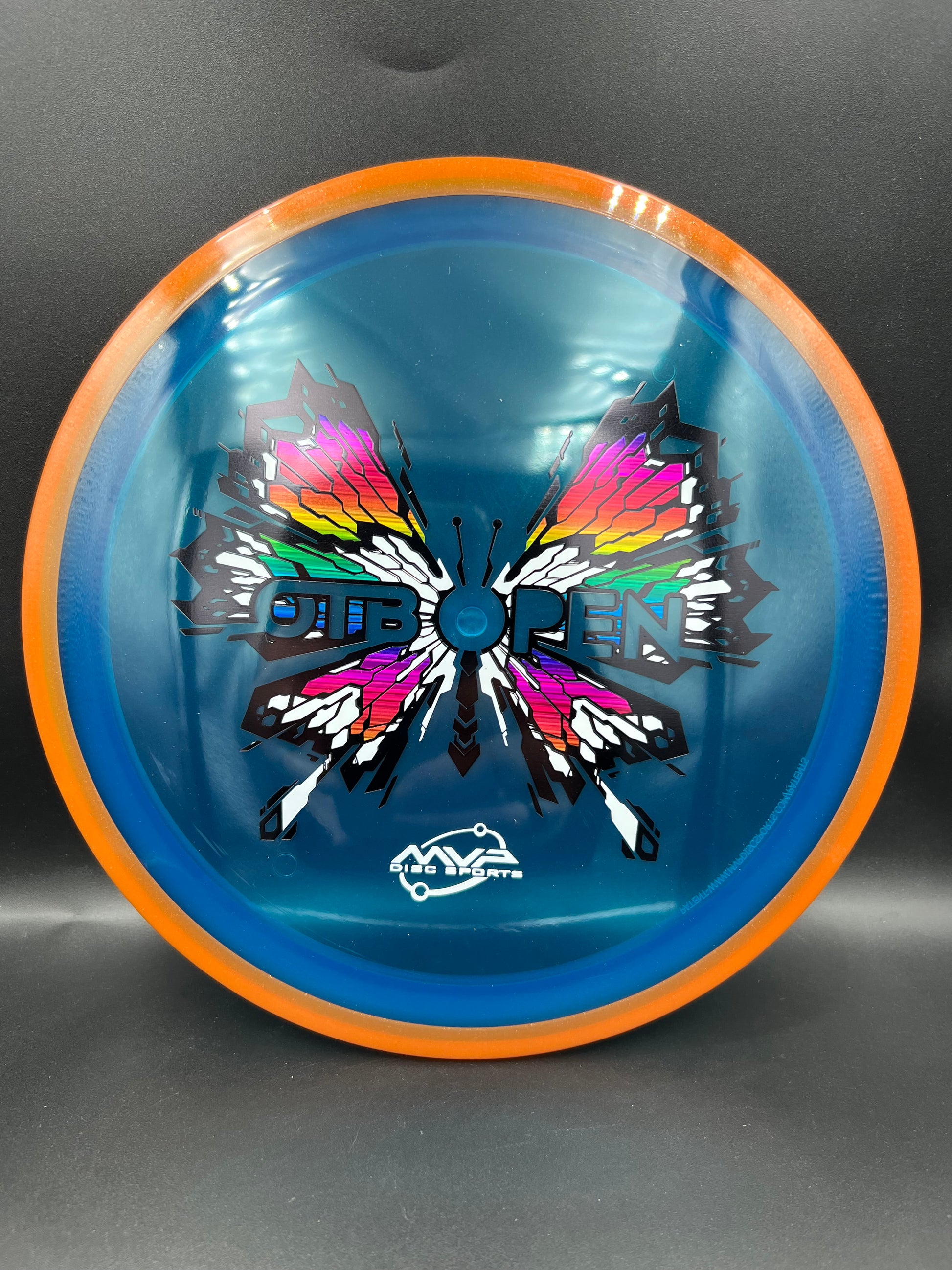 2026 OTB Axiom Prism Proton Soft Insanity Orange Rim Blue Plate - 159g